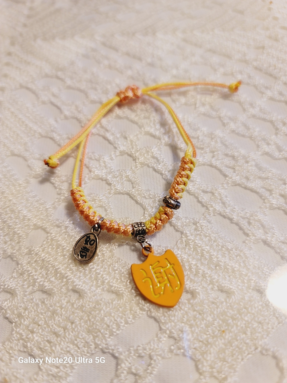 Yellow Orange Friendship Bracelet with Shield Charm